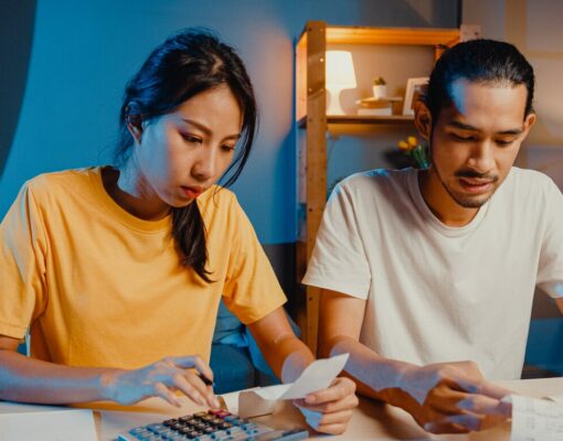 stress asian couple man woman use calculator calculate family budget 7861 2971